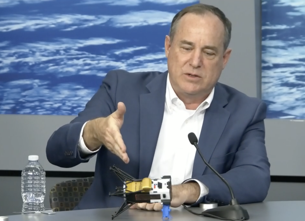 Intuitive Machines CEO Steve Altemus demonstrates the state of the Odysseus lunar lander. Image: Intuitive Machines.
